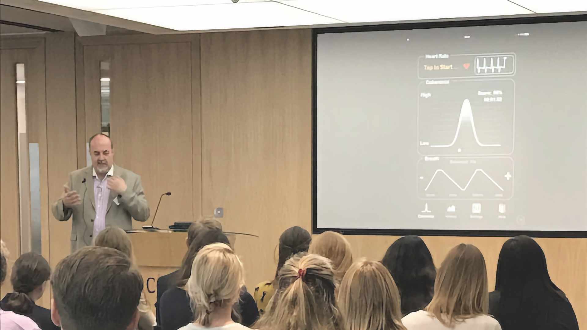 Robert explaining mindfulness techniques using course materials